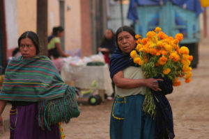 In Santa Fe de la Laguna, Michoacán, families keep bringing fresh flowers to the cemetery.