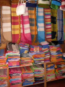 Colorful Mexican weavings and textiles in the Oaxaca market of Santo Tomas. © Alvin Starkman, 2011