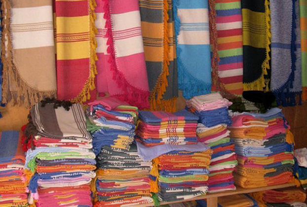 Colorful Mexican weavings and textiles in the Oaxaca market of Santo Tomas. © Alvin Starkman, 2011