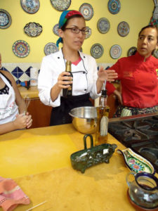 Ninfa Cecilia Raigosa Paras gives a lesson on balsamic vinegar and olive oil at Chef Pilar Cabrera's Casa de los Sabores cooking school in Oaxaca. © Alvin Starkman, 2011