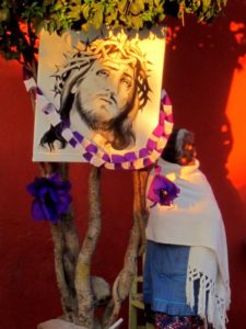 Wrapped in a warm white shawl, an older woman awaits the Procession of Our Lord of the Column, which takes place each year on Good Friday in San Miguel de Allende © Edythe Anstey Hanen, 2013