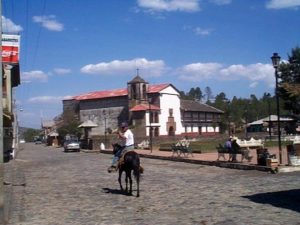 The square with the church in Angahuan. Horsemen will talk to you all along your walk to and from the visitors' complex. My amigo here happily engaged me in conversation.