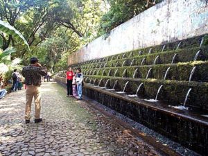 This water display with a beautiful but faded mural above is popular for family photos.