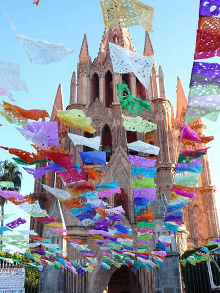 San Miguel de Allende's Parroquia and plaza decorated with cut paper banners © Sylvia Brenner, 2010, 2012
