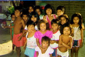 The Whole Gang (1992) I took this picture in the Costa Chica village of La Petaca in 1992. This village is not an Afro-Mexican community, but is made up mainly of Amuzgos (a indigenous ethnic group), and mestizos. I visited this tiny community of about 50 houses in 1997, and was pleased to find the 8 x 10 duplicate of this very photograph that I gave them years ago proudly displayed on the wall. The economic activity of this village revolves around the immense mango grove adjacent to it, and nearly everyone in town depends on it.