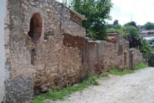 Ancient stone buildings line the quiet streets of Mineral de Pozos in Guanajuato, Mexico © John Scherber, 2012