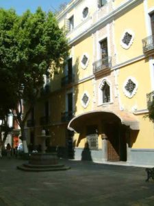 The side entrance of the Colonia Hotel across from the Iglesia de la Compañia is in a little shaded plaza.