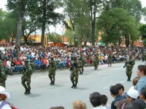 Special forces personnel with painted faces. Snipers behind.