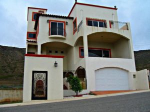 Balconies, wide windows and ornate wrought iron grillework are characteristic of Baja California architecture. This home is located in Rosarito beach, in the beach community of Puerta del Mar © Baja 123, 2012