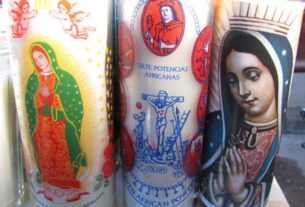 Candles are among the many Guadalupe themed items for sale outside the cathedral in Oaxaca on December 12 © Tara Lowry, 2014