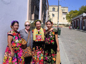 Norma with Tehaunas -- women from the ithsmus of Tehuantepec -- in their traditional dress. © Norma Hawthorne 2008