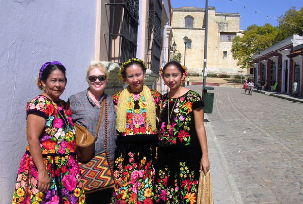 Norma with Tehaunas -- women from the ithsmus of Tehuantepec -- in their traditional dress. © Norma Hawthorne 2008