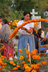 Extreme love and care are used to erect flower arrangements and decorations for the graves.