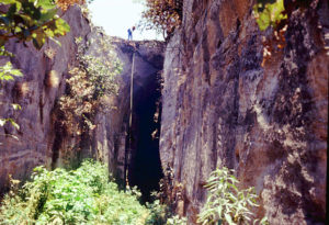Cavers surveying at the large entrance to Qanat La Venta in Jalisco, Mexico, which today is closed to the public due to fear of collapses. © John Pint, 2011