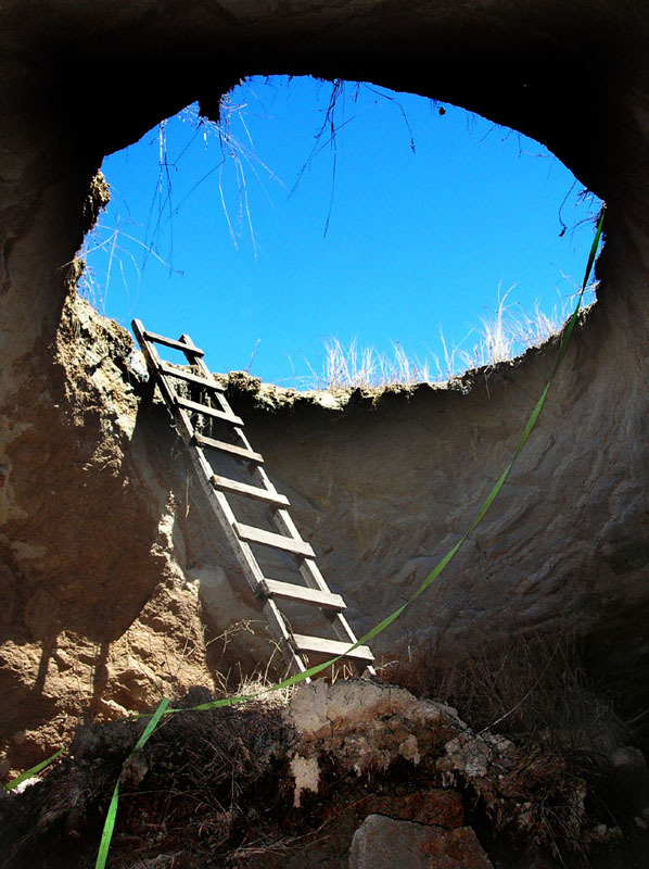 This collapse swallowed a tractor in a field located ten kilometers west of Guadalajara, Mexico. A forgotten qanat underneath this area may be the cause. © John Pint, 2011