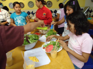 Ninfa Cecilia Raigosa Paras gives a lesson on balsamic vinegar and olive oil at Chef Pilar Cabrera's Casa de los Sabores cooking school in Oaxaca. © Alvin Starkman, 2011