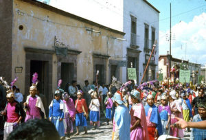 The image of El Señor de la Columna is carried to the parish church on the plaza, accompanied by townspeople dressed as Jesus' disciples and Roman centurions. These processions are part of the annual Good Friday observances in the Mexico town of San Miguel de Allende. This photograph dates from the 1960s. © Don Fyfe Wilson, 1964, 2010