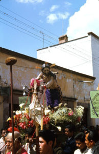 The image of El Señor de la Columna is the focal point of the midday procession in San Miguel de Allende. Wearing purple velvet, Christ is tied to a pillar, his back covered with blood. These processions are part of the annual Good Friday observances in the 400-year-old Mexican town. Although this photo was taken in the 1960s, the rituals are much the same today. © Don Fyfe Wilson, 1964, 2010