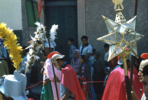 Elaborately costumed Roman warriors parade through the streets and take part in a 1960s Good Friday passion play. Beautiful religious images, lovingly crafted by skilled santeros, are reverently carried through the town of San Miguel de Allende, Mexico in the 1960s. These processions are part of the annual Good Friday observances. © Don Fyfe Wilson, 1964, 2010