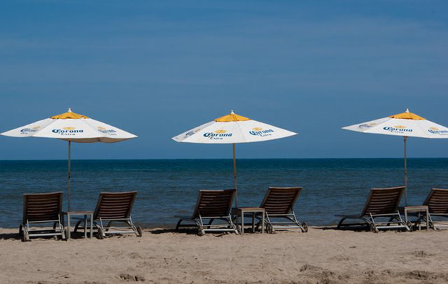 Beach chairs along the shore invite the visitor to relax a while in Sayulita, Mexico © Christina Stobbs, 2012