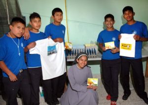 Sister Magdalena with students displaying some of their silk screening results at Villa de los Niños near Guadalajara, Mexico © John Pint, 2012