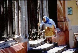 The faithful climb the stone steps of La Parroquia to worship in the neo-gothic sanctuary.