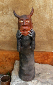 This Manuel Reyes ceramic sculpture depicts a male figure wearing a devil mask. In Mexico, the devil is sometimes portrayed as a comic figure. © Alvin Starkman 2008