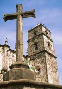 A cross reaches skyward from the atrium of the 18th century Mision San Javier in Baja California Sur. © John McCaffery, 2001