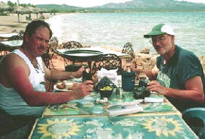 Author John McCaffery and a friend dine on fresh seafood at a beachfront eatery in Loreto, Baja California Sur. © John McCaffery, 2001