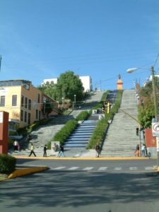 Hills ring the city so you find stairs at most of the edges. These are the showcase set leading to the Heroes Monument near the bus station (looking southwest).