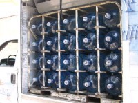 Water delivery truck stocked with full <i>garrafones</i>.