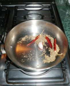 Toast the chiles and herbs in a dry skillet. © Daniel Wheeler, 2010