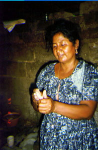Golpeando (Pounding Tortillas) (1997) Tortillas are the staple food throughout Mexico and have been long before the coming of the Spanish. In rural areas, such as the Costa Chica, they are the most important part of the daily diet. Tortillas are generally eaten with every meal, and are made from a dough that consists of ground corn and lye. This photo shows a woman foming a tortilla out of the dough. After flattening it out by hand, she will then cook it on a wood-heated clay cooking surface called a comal. photo credit: Jeannie Young