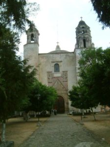 Through the gate the view (west) of the Ex-Convento Dominico de la Navidad.