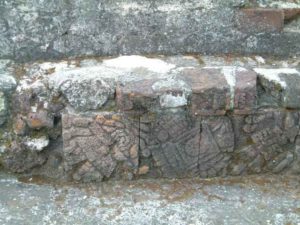 Closeups of the surviving carved stones testify to its former beauty.