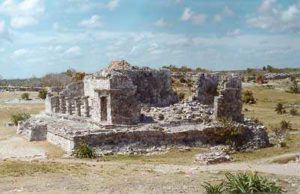Ancient Maya structures in Tulum are beautiful beneath the tropical skies of Mexico. © Anthony Wright, 2001