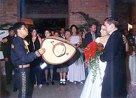 A mariachi group often plays as the newlyweds leave the church, then escorts them to promenade at the plaza.