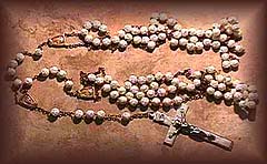 During the wedding mass, two members of the wedding party place the ends of the rosary lazo over the couple, "tying the knot".