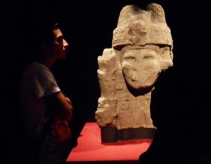 A visitor contemplates a sculpture at Mexico City's Templo Mayor museum © Anthony Wright, 2013