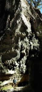 John Dye of California pauses beneath a high cliff inside Mexico's Arroyo El Carbon, which, in some places is less than one meter wide © John Pint, 2014