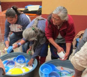 Women wash up after the Wednesday midday at the Parroquia in San Miguel de Allende. © Edythe Anstey Hanen, 2013