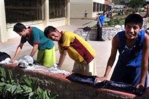 Boysat Villa de los Niños near Guadalajara, Mexico washing their shirts in the sunshine © John Pint, 2012