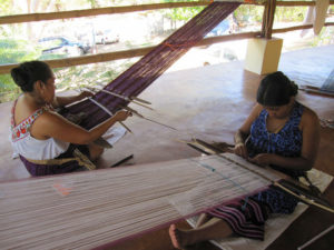 Weavers from the Tixinda women's cooperative in Pinotepa de Don Luis work together on traditional backstrap looms. © Geri Anderson, 2011