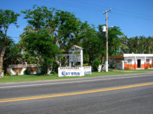 Entrance to Quinta Alicia Trailer Park on the highway that runs along Mexico's palm covered Emerald Coast in Veracruz. © William B. Kaliher, 2010