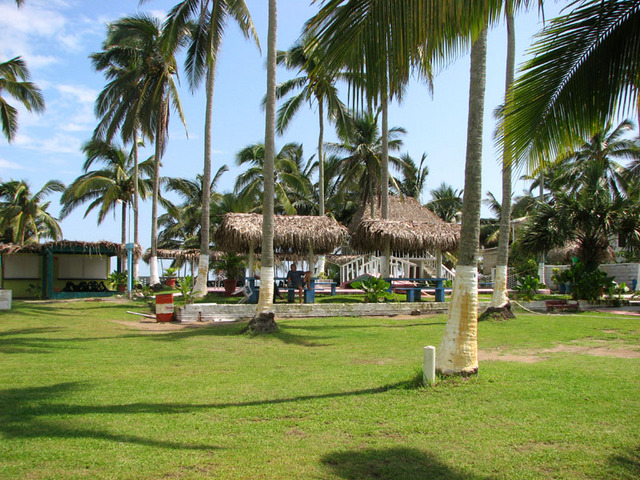 Thatch roof shelters are the perfect pace to socialize at Quinta Alicia Trailer Park on the Emerald Coast of Veracruz. © William B. Kaliher, 2010