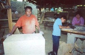Angel Cuin Juárez, 50 (L) and his 13-year-old son, Juan Esteban, in their shop in Cuanajo