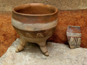 A Mexican pre-Hispanic potsherd stands next to Manuel Reyes' representation of a three-footed vessel. © Alvin Starkman 2008