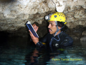 Explorer and author Gustavo Vela takes notes inside Sistema Yok Ha' Hanil, said to be "the driest cave in Quintana Roo." Located in the Tucatan Peninsula, such caves are often related to cenotes, or sinkholes in the underlying limestone. © Tania Ramirez, 2010