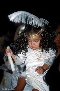 This little angel takes a break from the Holy Week pageantry in Taxco, Mexico. © Jim Allen, 2002