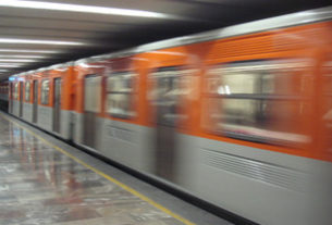 A train roars off in the underground. This is the Mexico City metro. © Anthony Wright, 2011